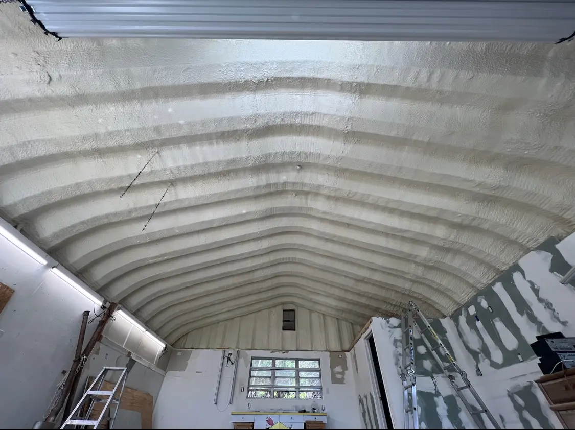 Spray polyurethane foam applied to the underside of a metal roof deck in Gadsden